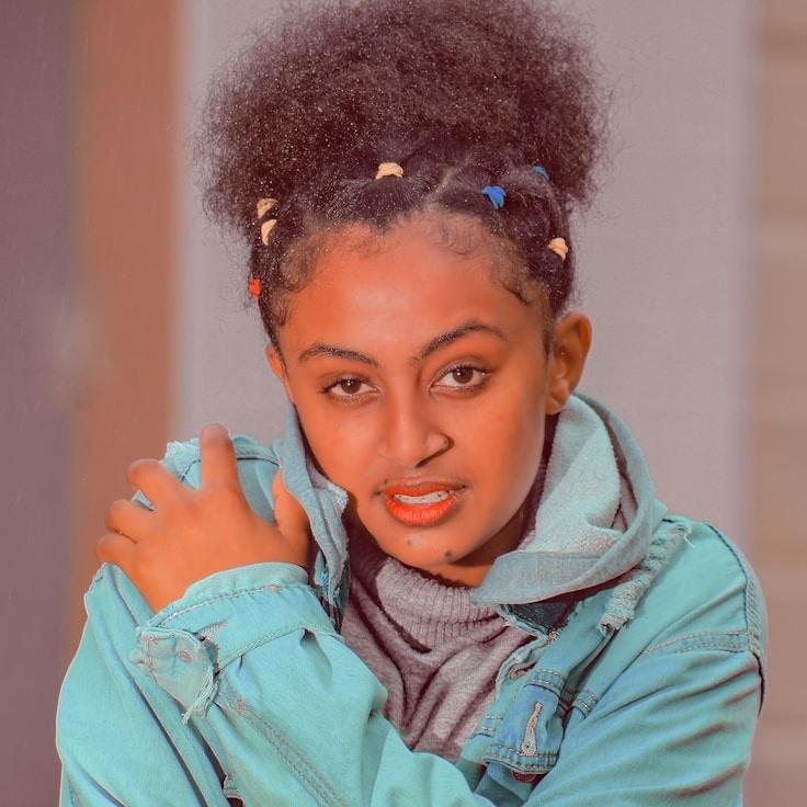 Anya Malik, Lead Design Curator at ClearAnchorArchive, reviewing corporate floral arrangements